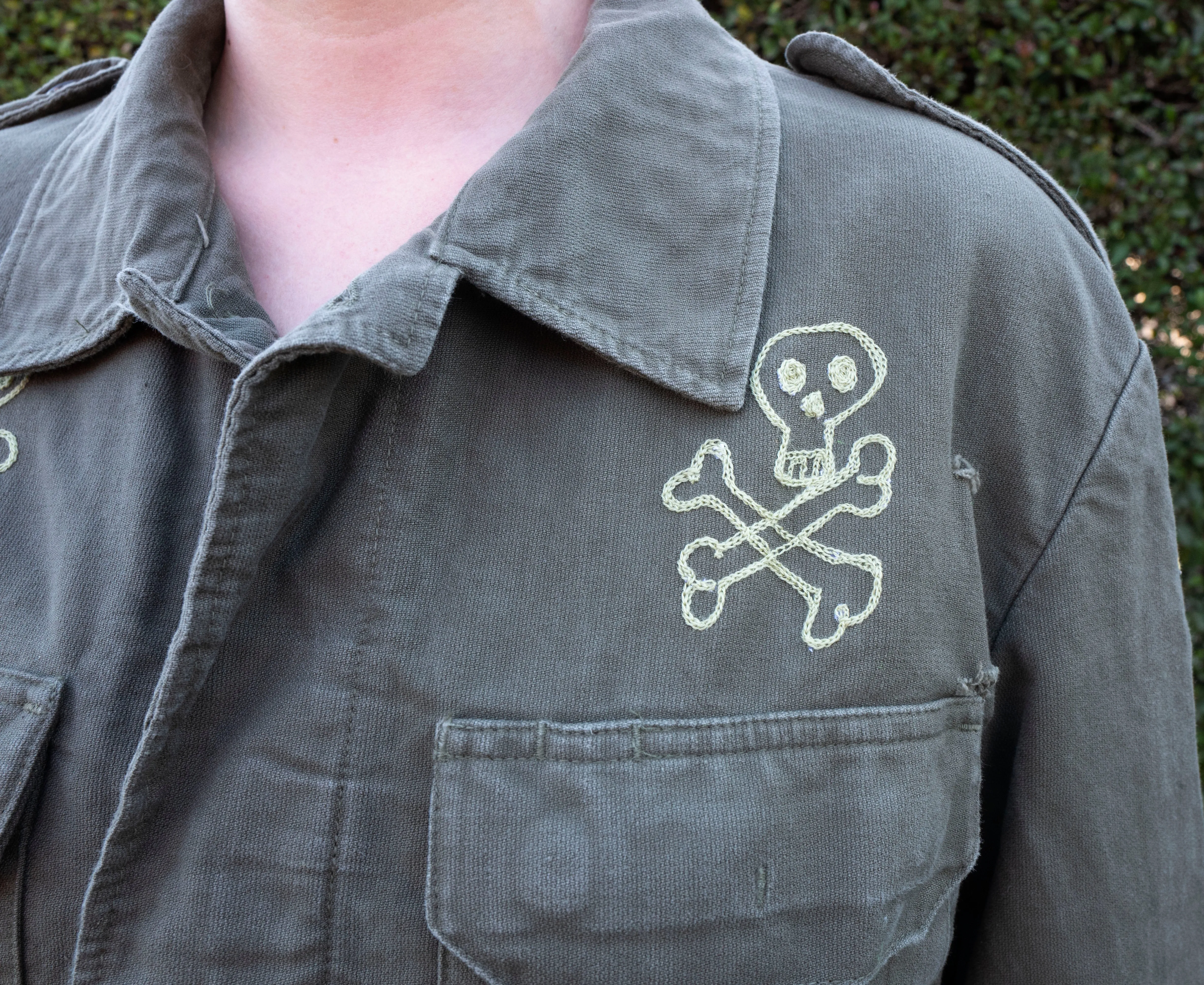 Olive Drab German military jacket: skull crossbones and snake vs mouse